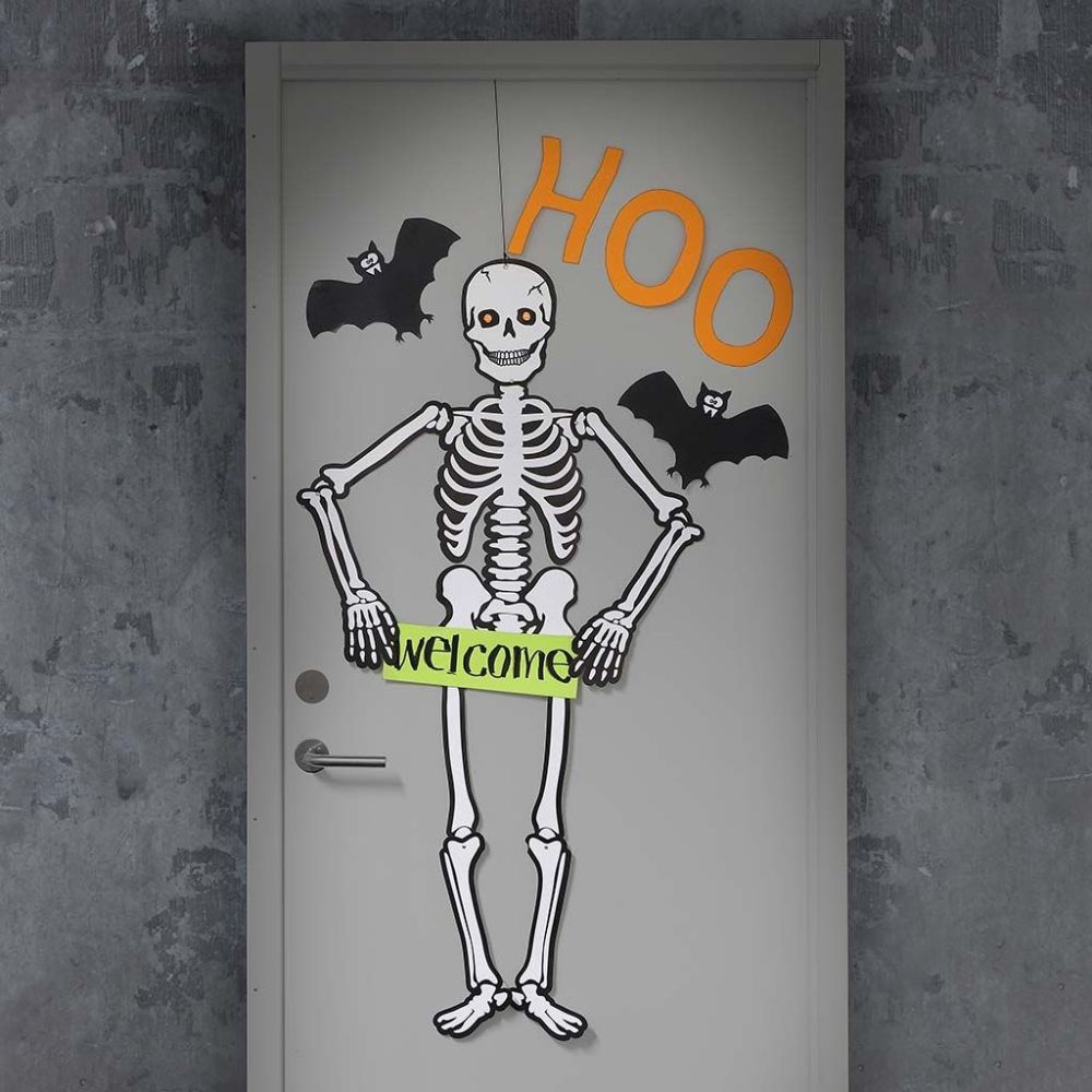 A Halloween Door Decorated With A Large Skeleton And Bats pertaining to Printable Halloween Door Decorations